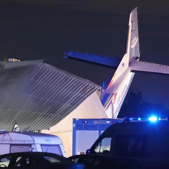 Plane hits hangar where people were sheltering in storm in Poland. Pilot and 4 others die and 8 hurt